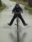 SX17154 Jenni cycling through flooded road.jpg